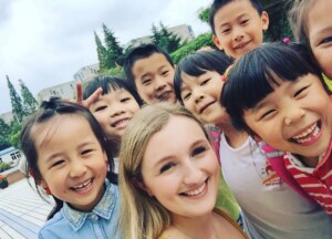 Teacher outside a school in China
